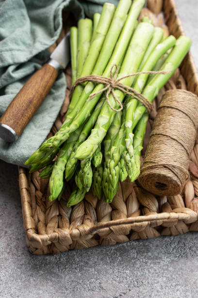 istock Fresh green asparagus on  concrete background. 1691695009