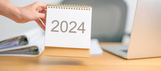 istock 2024 Year Calendar on table background. countdown, Happy New Year, Resolution, Goals, Plan,  Action, Mission and financial Concept 1691709458