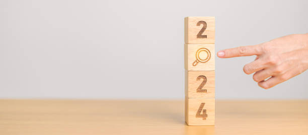 istock 2024 block with magnifying glass icon. SEO, Search Engine Optimization, hiring , Advertising, Idea, Strategy, marketing, Keyword, Content and New Year start concepts 1691709477