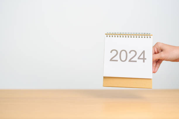 istock 2024 Year Calendar on table background. Happy New Year, Resolution, Goals, Plan,  Action, Mission and financial Concept 1691709488