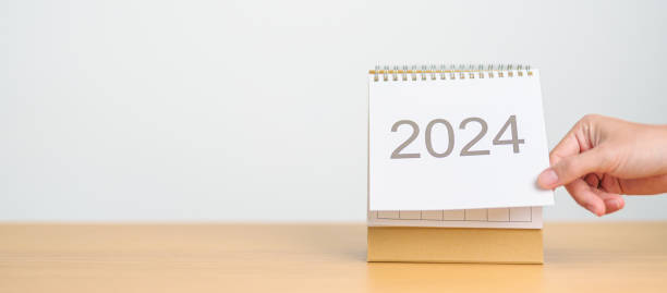 istock 2024 Year Calendar on table background. Happy New Year, Resolution, Goals, Plan,  Action, Mission and financial Concept 1691709965