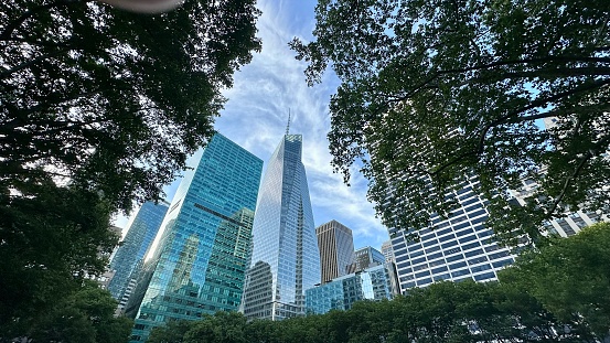 Guangzhou, China - August 1st, 2015: general view of Guangzhou downtown skyscrapers and main part of the city emerging from the trees on the top of Baiyun viewpoint on a cloudy but not polluted day in the south of China.