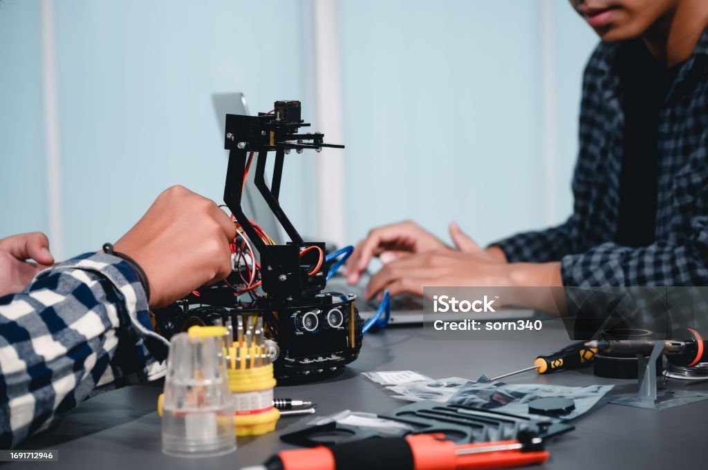 Robotics Combines Computer Science Engineer Asian Students Assembling Robotics Kits Learning Mechanical ...