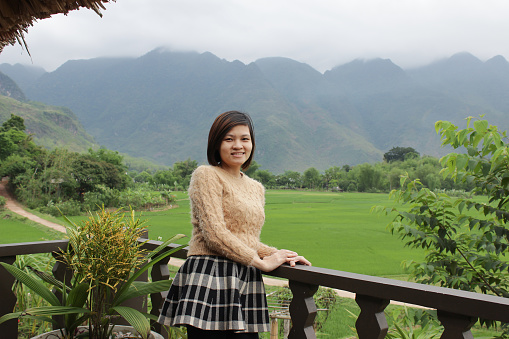 The woman is very happy in her travelling to Moc Chau province of Vietnam