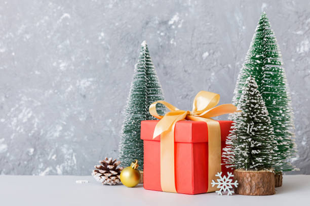 istock Christmas composition. craft Gift box, small tree, branches and craft DIY decorations on white background. New year concept. Christmas home decoration Flat lay, top view, copy space 1691759263