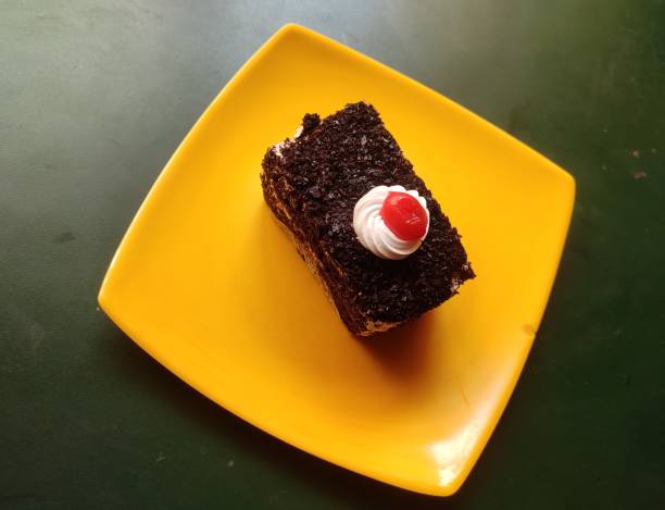 istock Black Forest cake is a chocolate and cream cake with a rich cherry filling based on a German dessert. It consists of several layers of chocolate sponge cake sandwiched with whipped cream and cherries. 1691763582