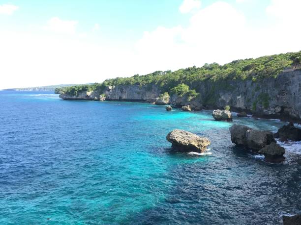 istock Idyllic Appalarang Cliff overlooking a tranquil ocean inlet with serene waves lapping at the shore 1691763593