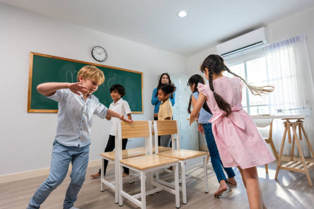 istock Group of student learn with teacher in classroom at elementary school. Attractive beautiful female instructor master explain and educate young children with happiness and fun activity at kindergarten. 1691814062