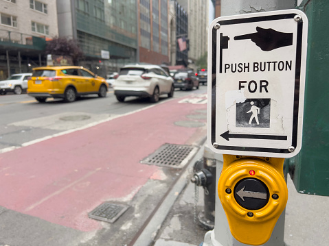 crosswalk, Push button for crosswalk sign in street of New York. Crosswalk push button and sign with selective focus on street pole. Traffic control. Safely cross a road.
