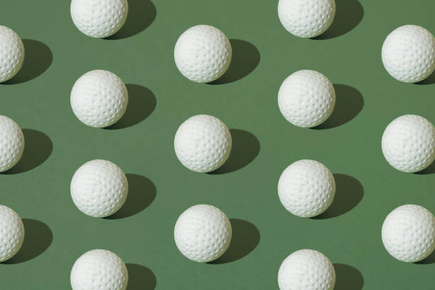 istock White golf ball on a green pastel background. Pattern. 1691840987