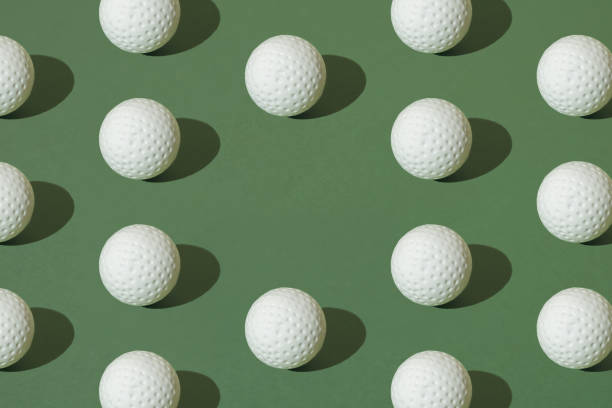 istock White golf ball on a green pastel background. Minimal pattern. 1691840991