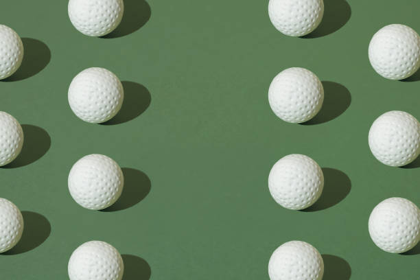 istock White golf ball on a green pastel background. Minimal pattern with copy space. 1691840994