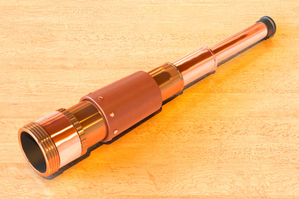 istock Brass Hand Held Telescope on the wooden table. 3D rendering 1691848372