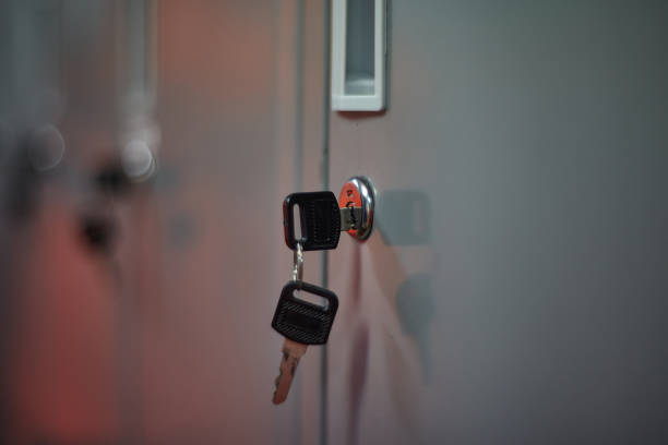 Close up of metal storage lockers with keys inside.