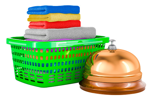 Laundry basket full of clean clothes with reception bell, 3D rendering isolated on white background