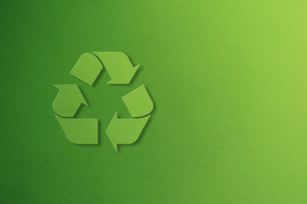 Green painted wall with a large recycling symbol on the left