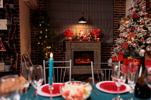 istock Festive christmas tree near fireplace 1691865244