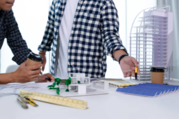 istock Asian Architect Students Studying Modern House Design and Finding Ways to Utilize Natural Alternative Energy or Use Natural Renewable Energy, Concepts of Eco-Friendly Living for a Sustainable Future. 1691882126