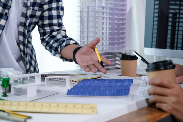 istock Asian Architect Students Studying Modern House Design and Finding Ways to Utilize Natural Alternative Energy or Use Natural Renewable Energy, Concepts of Eco-Friendly Living for a Sustainable Future. 1691882127