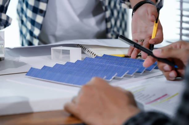 istock Asian Architect Students Studying Modern House Design and Finding Ways to Utilize Natural Alternative Energy or Use Natural Renewable Energy, Concepts of Eco-Friendly Living for a Sustainable Future. 1691882128