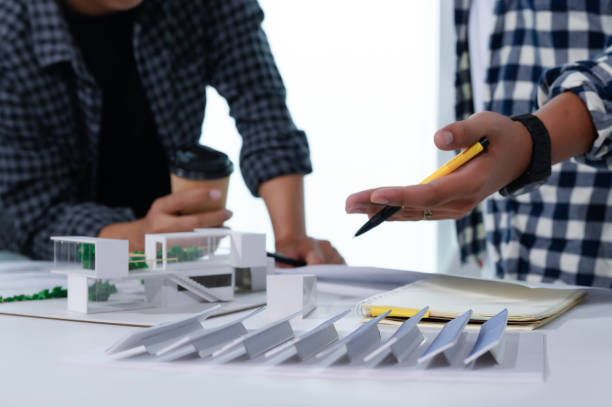 istock Asian Architect Students Studying Modern House Design and Finding Ways to Utilize Natural Alternative Energy or Use Natural Renewable Energy, Concepts of Eco-Friendly Living for a Sustainable Future. 1691882136