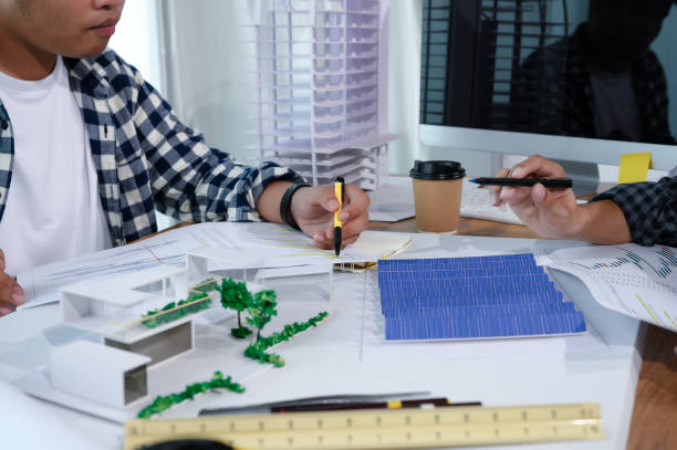 istock Asian Architect Students Studying Modern House Design and Finding Ways to Utilize Natural Alternative Energy or Use Natural Renewable Energy, Concepts of Eco-Friendly Living for a Sustainable Future. 1691882140