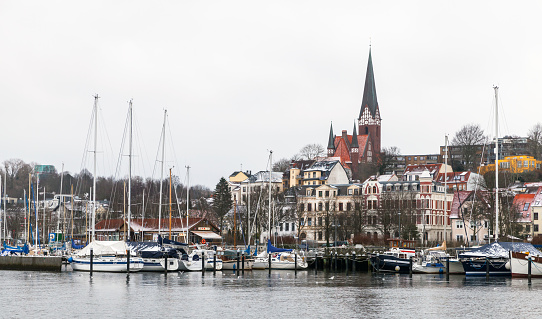 Flensburg, Germany - February 9, 2017: Flensburg town coastal skyline under cloudy winter sky