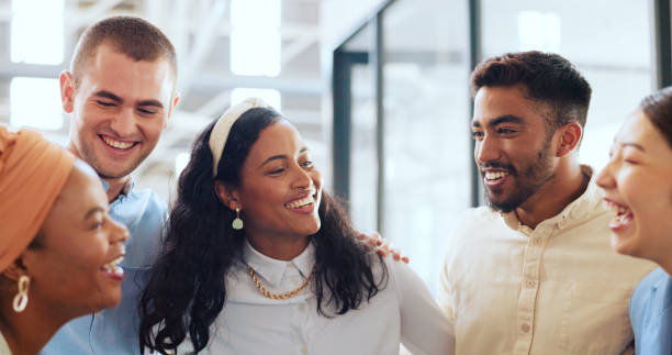 istock Office, diversity and business people hug for team building, teamwork and collaboration. Happy workers, smile and embrace in motivation, goals or vision of about us, company trust and startup growth 1691892809