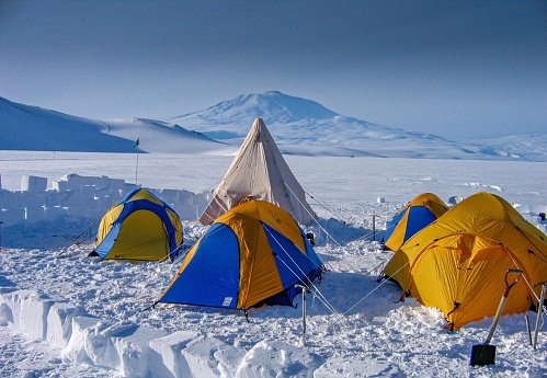 McMurdo Antarctica, United States – September 01, 2007: A picturesque winter scene featuring several tents set up on a snow-covered mountaintop