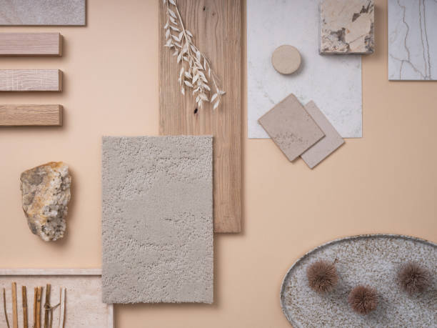 Creative flat lay composition with textile and paint samples, panels and cement tiles. Stylish interior designer moodboard. Light beige and gray color palette. Copy space. Template.