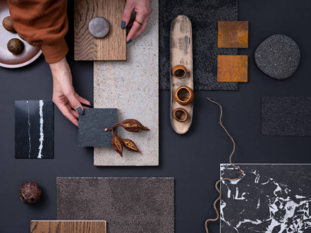 Elegant  flat lay composition in grey and black color palette with textile and paint samples, lamella panels and tiles. Architect and interior designer moodboard. Top view. Copy space.