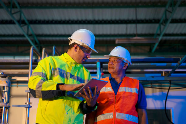 istock Blue collar worker work at beverage manufacturing factory. 1691909532