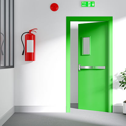 Fire exit door for emergency office. Building Emergency Exit with Exit Sign and Fire Extinguisher.