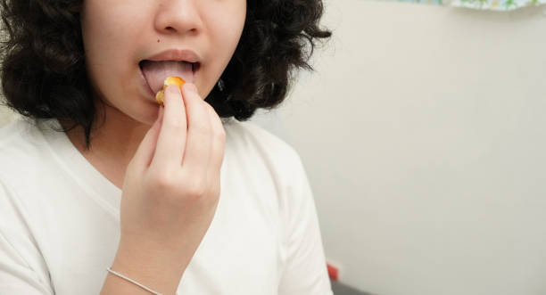 istock Young asian girl eating snack 1691931948