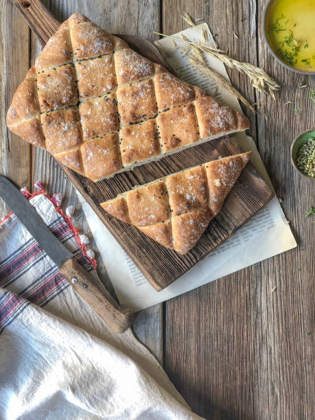 istock artisan bread on white cutting board on wooden table 1691934499