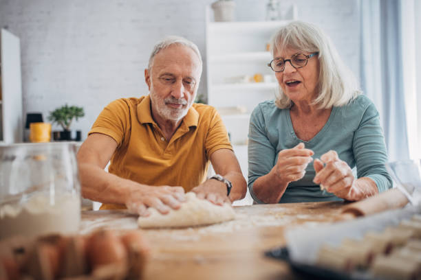 istock Senior couple preparing food 1691935557