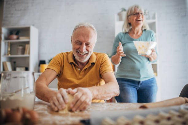 istock Senior couple preparing food together 1691938508