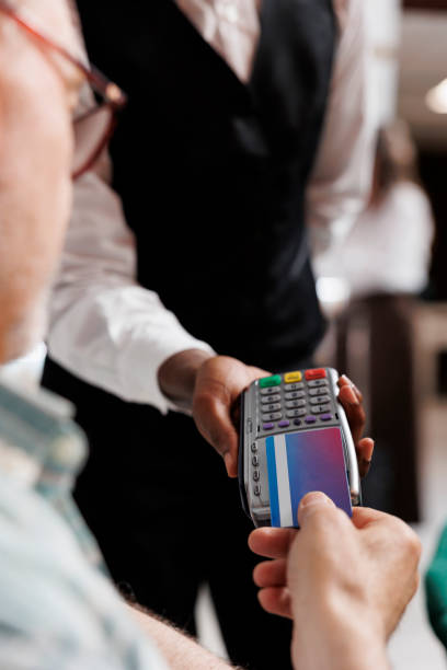 istock Guest makes payment with card in hotel 1691945429