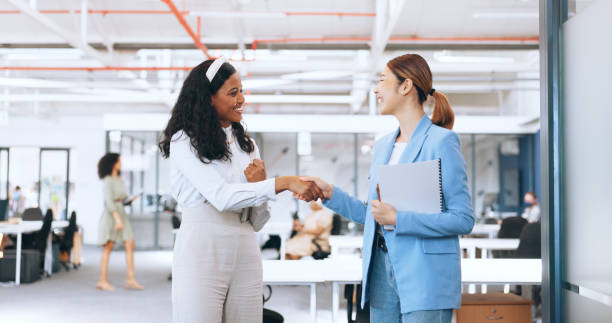 istock Business women, hand shake and high five for success celebration in office. Sequence, group teamwork or partnership of female friends or employees walking, talking and shaking hands for collaboration 1691960937