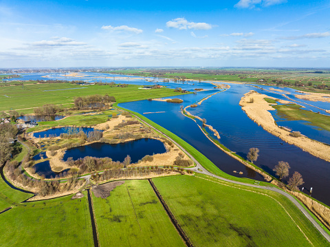 High water level in the Zwarte Water river at the town of Hasselt in Overijssel, The Netherlands. The river is overflowing on the floodplains after heavy rainfal upstream in The Netherlands and Germany during storm Eunice and Franklin in February 2022.