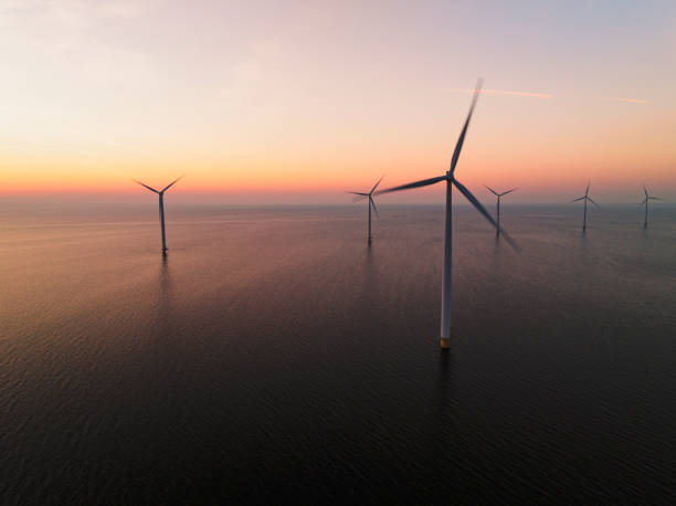 istock Wind turbines in an offshore wind park producing electricity during sunset 1691966760