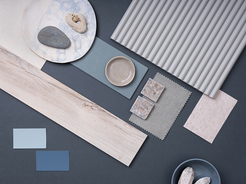 Modern flat lay composition with cement tiles, panels, facing, stones. Stylish interior designer moodboard. Blue, blue and gray color palette. Copy space. Template.