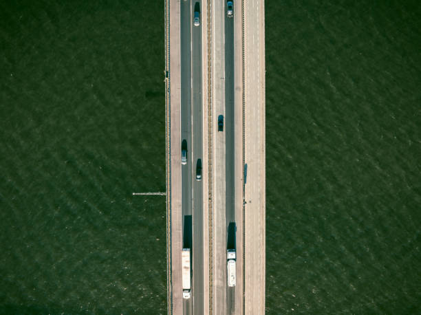 istock Traffic on a highway on a bridge overhead drone view 1691967384