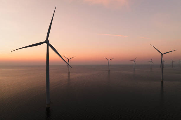 istock Wind turbines in an offshore wind park producing electricity during sunset 1691967952