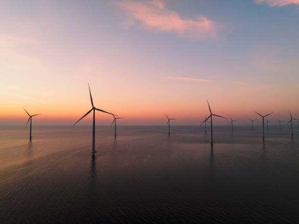 istock Wind turbines in an offshore wind park producing electricity during sunset 1691967992