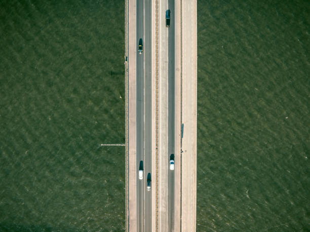 istock Traffic on a highway on a bridge overhead drone view 1691968692