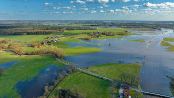 istock Vecht river high water level flooding at the Junne weir drone view 1691969082