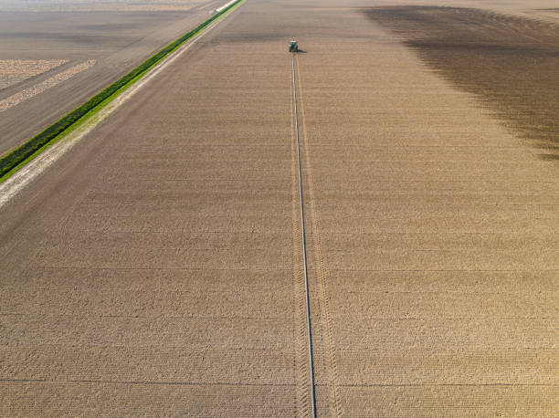 istock Tractor preparing the soil for planting crops 1691969102