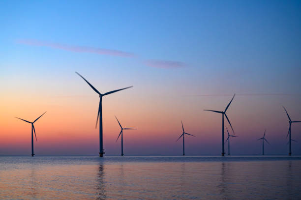 istock Wind turbines in an offshore wind park producing electricity during sunset 1691970253