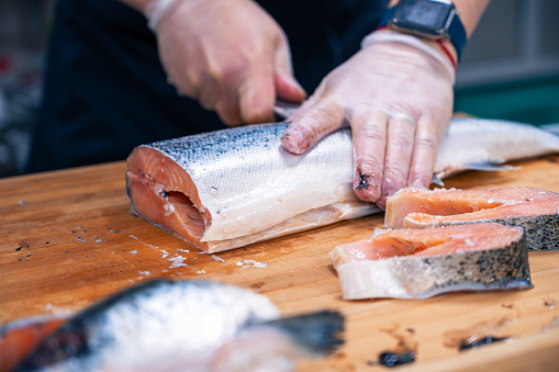 Chef preparing a salmon fish